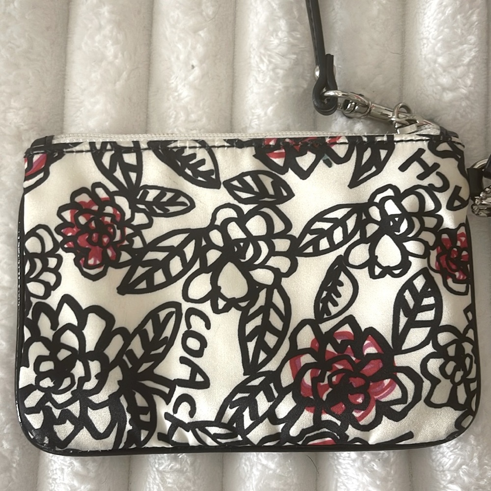 Coach Poppy Floral Wristlet with Black and Red Accents EUC
No Callouts - Picture 9 of 10